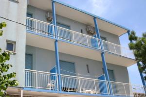 an apartment with blue balconies on a building at Hotel Niagara in Marotta +22 photos