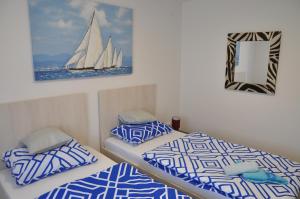 Postel nebo postele na pokoji v ubytování Apartmani Ana Vukovar + 29 fotografií