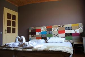 Ένα ή περισσότερα κρεβάτια σε δωμάτιο στο Green Garden Gabala Villas&Cottages