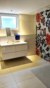 a bathroom with a sink and a window at Club Dres in Bockau