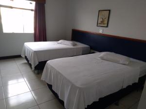 Łóżko lub łóżka w pokoju w obiekcie Virgilius Palace Hotel
