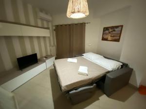 Posteľ alebo postele v izbe v ubytovaní Sara Home