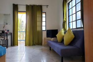 Predel za sedenje v nastanitvi Bay View Studio Apartment 3C - Canouan Island