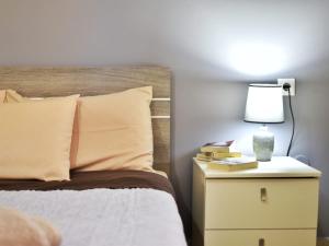 Posteľ alebo postele v izbe v ubytovaní Konomi Residence