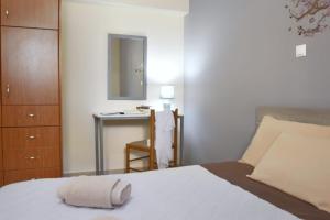 Posteľ alebo postele v izbe v ubytovaní Konomi Residence