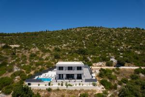 an aerial view of a house on a hill at VILLA Mari with private pool in Marina