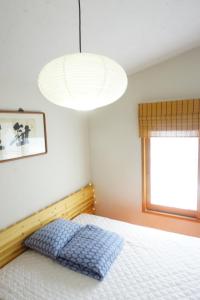 Postel nebo postele na pokoji v ubytování Tong Stay
