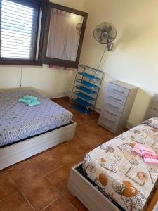 Katil atau katil-katil dalam bilik di Casa Mony