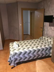 Cama o camas de una habitación en Hostal Casa Alonso