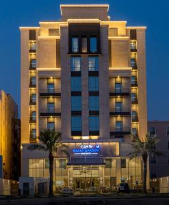 a hotel with a sign on the front of it at Beata Garden in Al Khobar