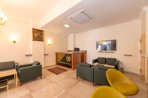 a living room with couches and a fireplace at Bazaar Hotels Old City in Istanbul