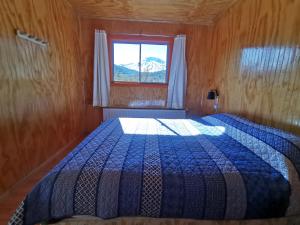 Hostal Piedra Santa tesisinde bir odada yatak veya yataklar