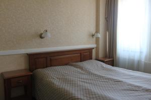 Posteľ alebo postele v izbe v ubytovaní Hotel Dominika