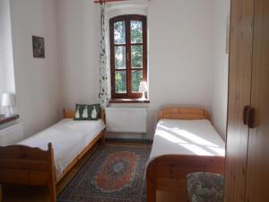 Postel nebo postele na pokoji v ubytování U Dvou lipek pod Broumovskými stěnami