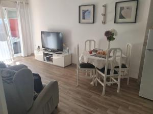 TV a/nebo společenská místnost v ubytování Complejo Minerva Jupiter