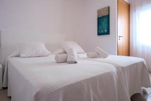 Postel nebo postele na pokoji v ubytování Sal Mar Suites