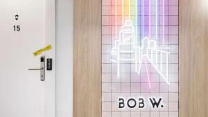 a door with a sign that says bobww next to it at Bob W Chueca in Madrid
