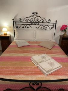 A bed or beds in a room at Affittacamere Mirella