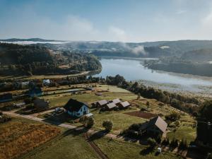 an aerial view of a house and a river at Siedlisko Wataha in Wołkowyja