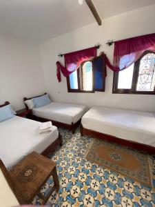 Llit o llits en una habitació de Hotel Nisrine