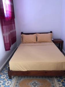 Ένα ή περισσότερα κρεβάτια σε δωμάτιο στο Hotel Nisrine