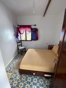 Ένα ή περισσότερα κρεβάτια σε δωμάτιο στο Hotel Nisrine