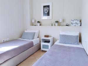 Postel nebo postele na pokoji v ubytování Comfy Apartment