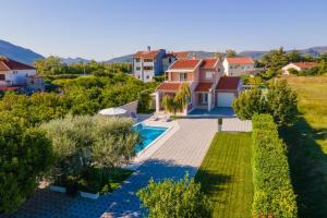 an aerial view of a house with a swimming pool at Villa Jerkovic in Metković