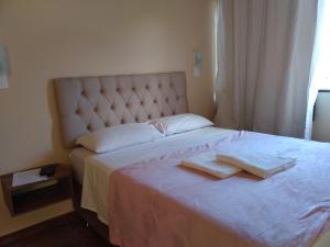 Cama ou camas em um quarto em Lumiar Chalé Jardim do Sossego