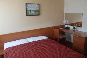 Posteľ alebo postele v izbe v ubytovaní Hotel Dominika
