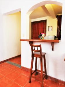 a kitchen with a table and chairs in it at Hotel Casa de la Tía Tere in Oaxaca City