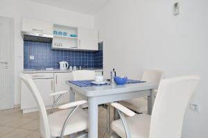Kuchyň nebo kuchyňský kout v ubytování Apartments Nautilus
