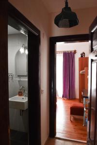 a bathroom with a sink and a mirror at Smyrna Pansiyon in Kaş +272 photos