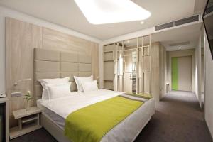 Cama o camas de una habitación en Hotel Colors Inn
