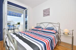 Postel nebo postele na pokoji v ubytování Apartments Nautilus