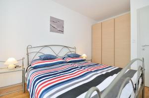 Postel nebo postele na pokoji v ubytování Apartments Nautilus