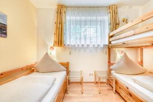 מיטה או מיטות בחדר ב-Panoramavilla Bludenz by A-Appartments
