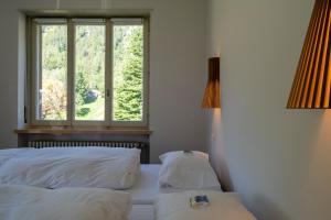Postel nebo postele na pokoji v ubytování Villa Pineta