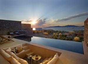 a living room with a view of the water at Bonzoe Suites & Villas in Mýkonos City