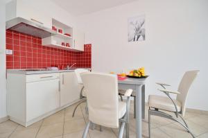 Kuchyň nebo kuchyňský kout v ubytování Apartments Nautilus