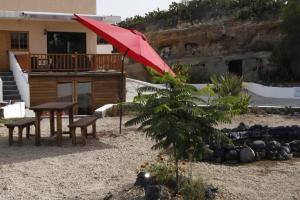 A garden outside Half wooden rural apartment
