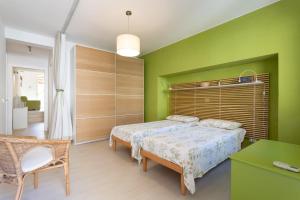 "Le Casette di Ninetta" - Casa vacanza Casmene tesisinde bir odada yatak veya yataklar