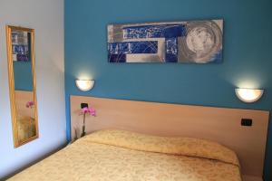 Ένα ή περισσότερα κρεβάτια σε δωμάτιο στο Lizard Hotel