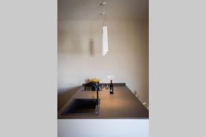 a kitchen with a sink and a counter top at cefalù luxury appartament in Cefalù +6 photos