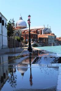 a street light in the middle of a water fountain at Residence Castello Venezia in Venice