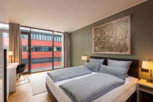Säng eller sängar i ett rum på Waveboard Hotel & Boardinghouse