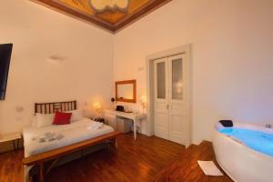 A bed or beds in a room at Naca Suite