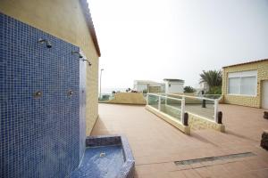 A balcony or terrace at Book Jet - HIBISCUS BEACH FRONT