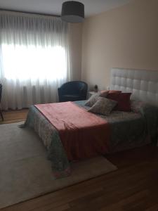 A bed or beds in a room at A CASA DE TOXO