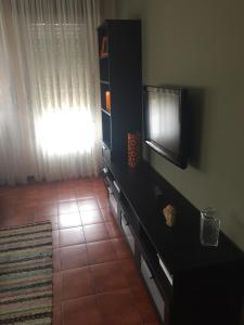 A television and/or entertainment centre at A CASA DE TOXO